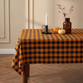 Waterproof Gingham Tablecloth - Black & Orange Checkered Fabric, 102" x 60" Rectangular for Indoor Outdoor Dining