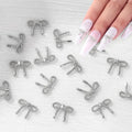 QPRETTY DU 3D Bow Nail Charms 100PCS Silver Metal Butterfly Nail and Gems Shiny Nails Art Decoration Supplies Accessories for Acrylic Nails DIY